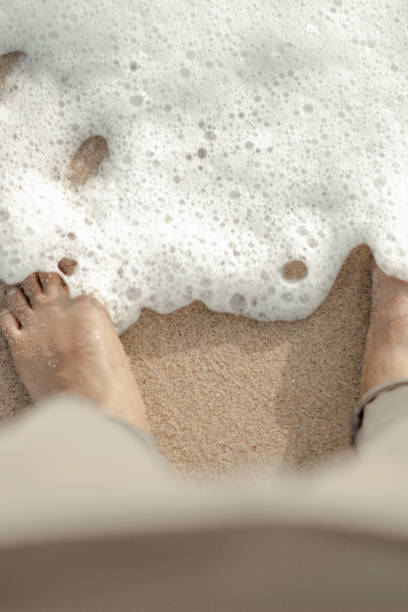istock Standing on the beach in the evening. 1337793852