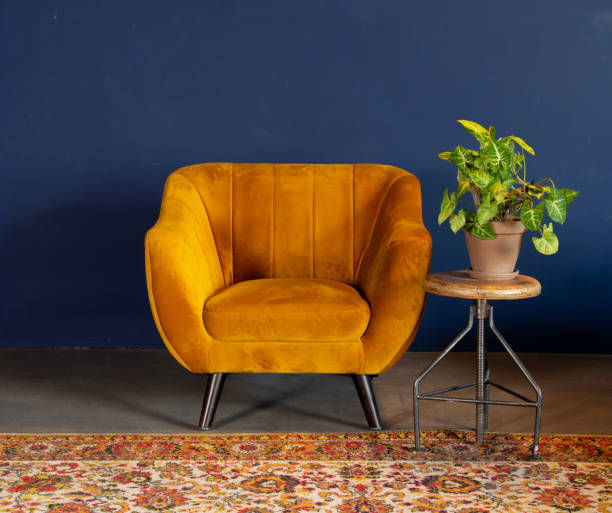 istock Interior element, yellow empty armchair against blue wall background, space for text, copy space 1337795504