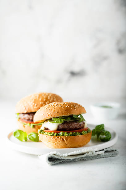 istock Beef burgers with pesto sauce 1337795997
