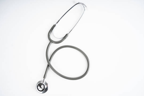 istock Gray medical stethoscope on white background in studio. 1337796495