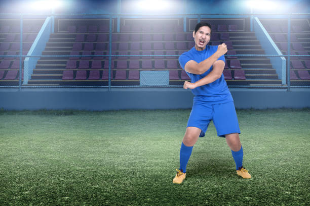 istock Asian soccer player man celebrate the victory 1337797540
