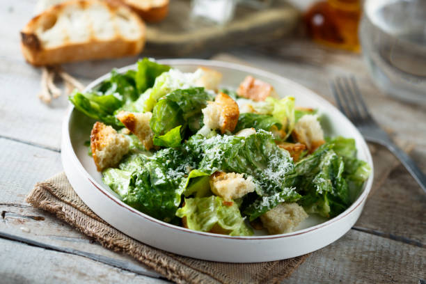 caesar salad - kruton stok fotoğraflar ve resimler