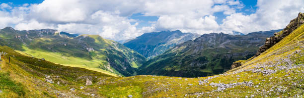 Austrian alps in early autumn - mountain range in clouds. Mountains landscape.