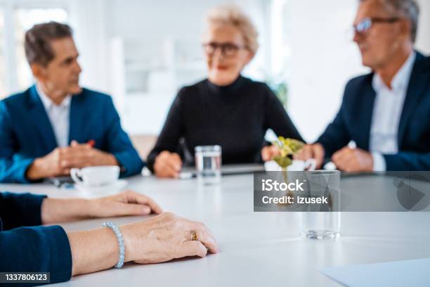 Senior Business People During Meeting Stock Photo - Download Image Now - Business Meeting, Serious, 65-69 Years