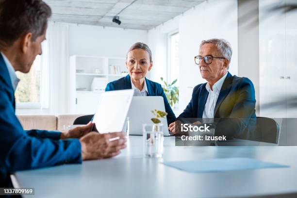 Senior Business People During Meeting Stock Photo - Download Image Now - Office, Business Meeting, Businesswear