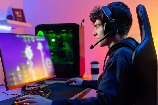 istock Male player in headset enjoying computer game 1337809377