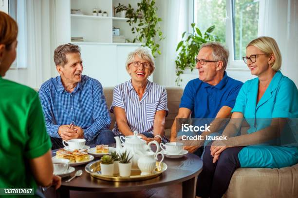 Cheerful Senior People In Retirement House Stock Photo - Download Image Now - Assisted Living, Meeting, Nursing Home