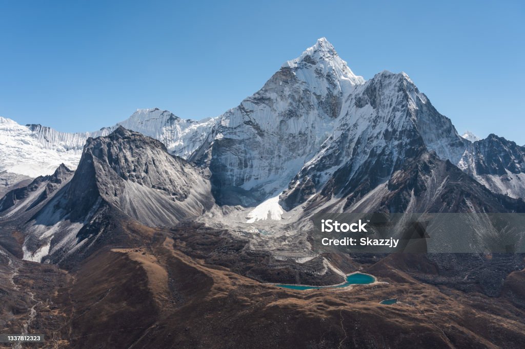 Ama Dablam mountain peak view from Dingboche view point, Everest or Khumbu region, Himalaya mountains range in Nepal Ama Dablam mountain peak view from Dingboche view point, Everest or Khumbu region, Himalaya mountains range in Nepal, Asia Himalayas Stock Photo