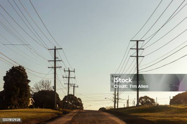 Electric Poles And Cables Along Country Road Stock Photo - Download Image Now - Power Line, Rural Scene, Electricity