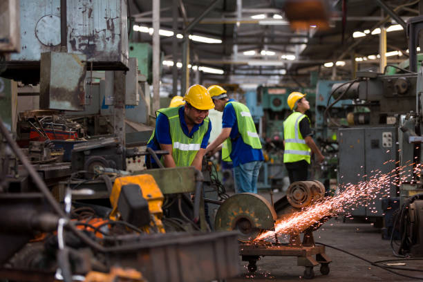 istock Male worker working with metal cutting saws. Asian male engineer worker working on cutting metal and steel with compound mitre saw and circular blade at the industrial factory 1337813422