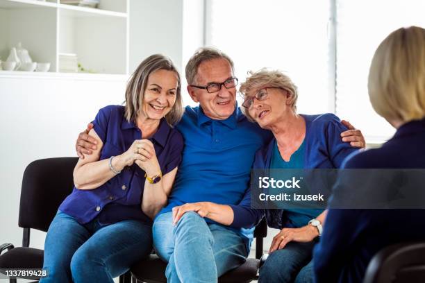 Cheerful Senior People During Group Therapy Stock Photo - Download Image Now - Happiness, Mental Health Professional, Patient