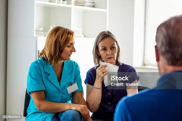 Elderly Lady Sharing Issues During Meeting Stock Photo - Download Image Now - Nurse, Emotional Stress, Group Therapy