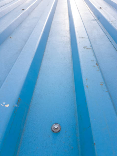istock Geometric lines and design on a rusty light blue tin metal roof 1337820902