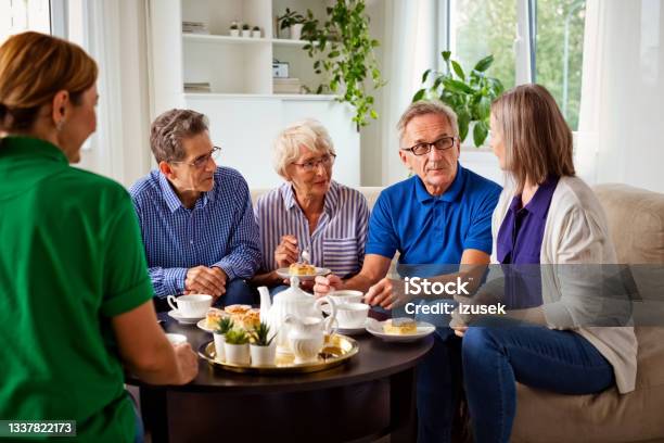 Cheerful Senior People In Retirement House Stock Photo - Download Image Now - Coffee - Drink, Senior Men, 70-79 Years