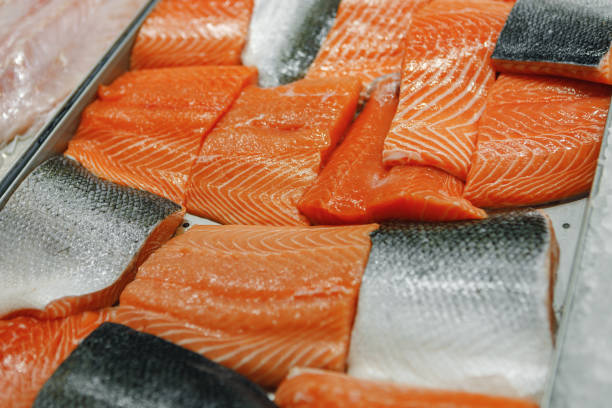 istock Fresh fish assorted on ice counter in supermarket 1337823053