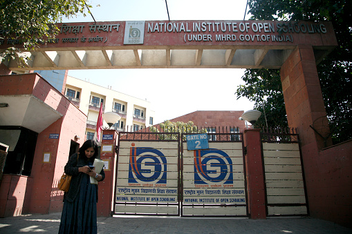 A visitor walks outside of Central office of National institute of Open Schooling (Under ministry of education, Government of India) in Noida Sector 62  Uttar Pradesh.