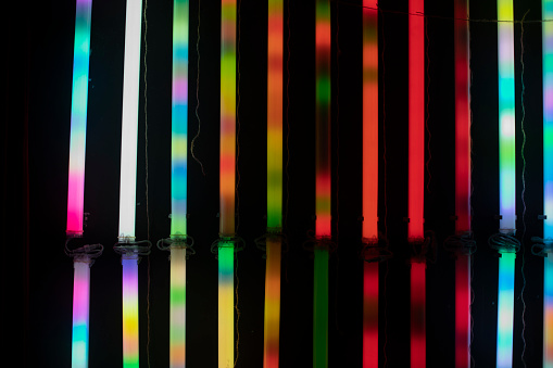 Colored RGB lamps. The glow of all colors from fluorescent lamps in the dark.