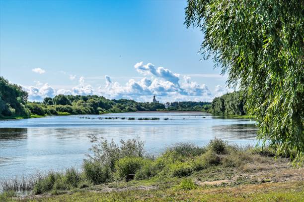 istock View of the Volkhov River and a distant Orthodox monastery. 1337829552