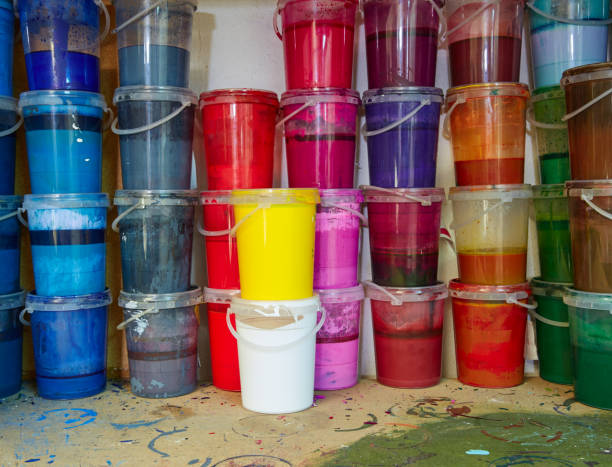 istock Colorful ink paint bottles in a row stacked 1337831777