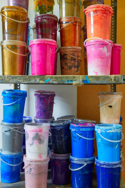 istock Colorful ink paint bottles in a row stacked 1337831969