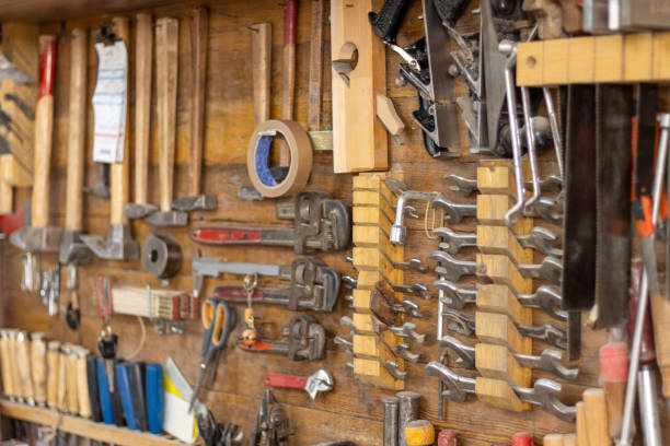 istock Various carpenter hand tools hanging on the wall in the carpentry workshop 1337833398