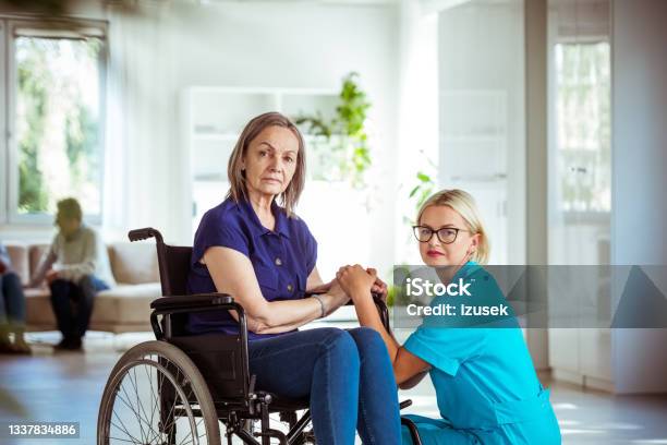 Elderly Lady In Wheelchair With Nurse Stock Photo - Download Image Now - Assisted Living, House, Nurse