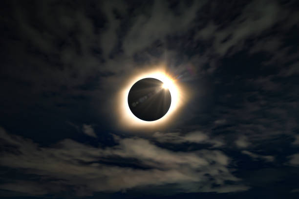 istock Solar eclipse. Full moon or lunar with light on sky in dark at night sky background. Space astronomy. Nature phenomena 1337835565
