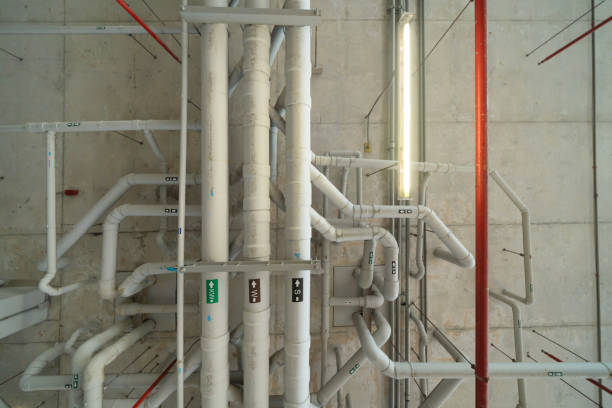 istock Ceiling of Industry factory. Chiller tower or cooling tower in building. System work machine. Condenser Water Supply and return pipe lines. Ventilation compressor. Water system in workshop. 1337835758