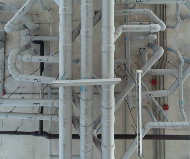 istock Ceiling of Industry factory. Chiller tower or cooling tower in building. System work machine. Condenser Water Supply and return pipe lines. Ventilation compressor. Water system in workshop. 1337835765
