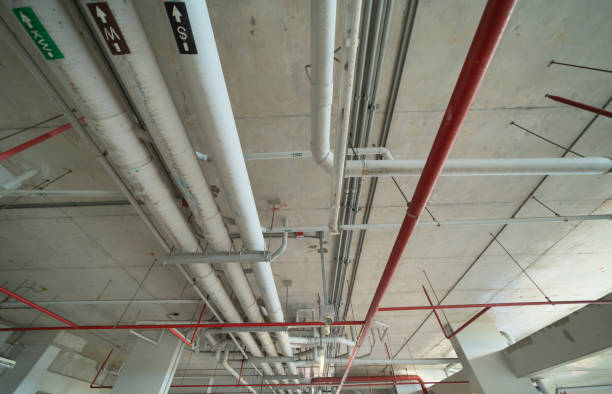 istock Ceiling of Industry factory. Chiller tower or cooling tower in building. System work machine. Condenser Water Supply and return pipe lines. Ventilation compressor. Water system in workshop. 1337835805