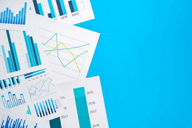 istock Office workplace table with report pages with financial data 1337835824