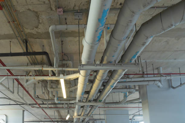 istock Ceiling of Industry factory. Chiller tower or cooling tower in building. System work machine. Condenser Water Supply and return pipe lines. Ventilation compressor. Water system in workshop. 1337835825
