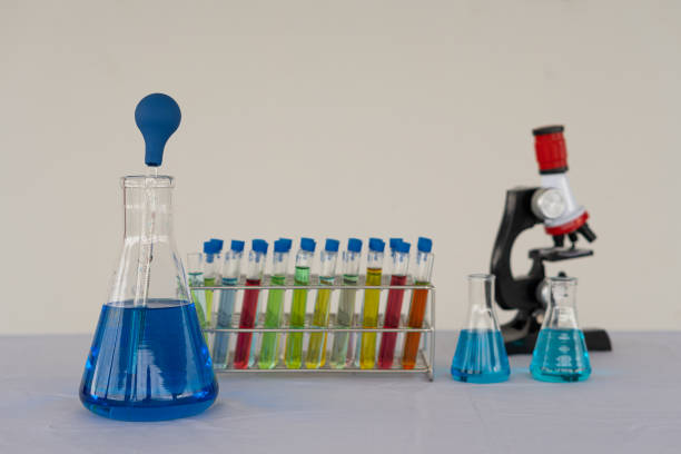 red-blue glass bottles of various colors and chemical structure in research. medical science technology background research and innovation - beaker with laboratory formula - medical sample imagens e fotografias de stock