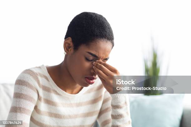 Sinusitis Concept Sick Young Black Woman Touching Her Nose Bridge At Home Stock Photo - Download Image Now