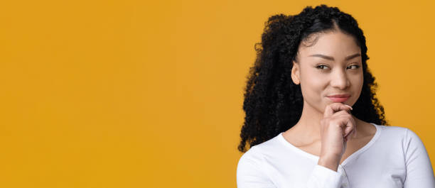 istock Curious Young African American Woman Looking With Interest At Copy Space 1337850525