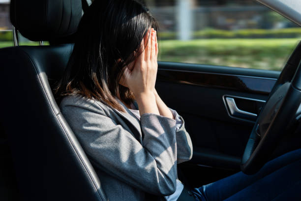 istock Stressed woman driver sitting inside car 1337857903