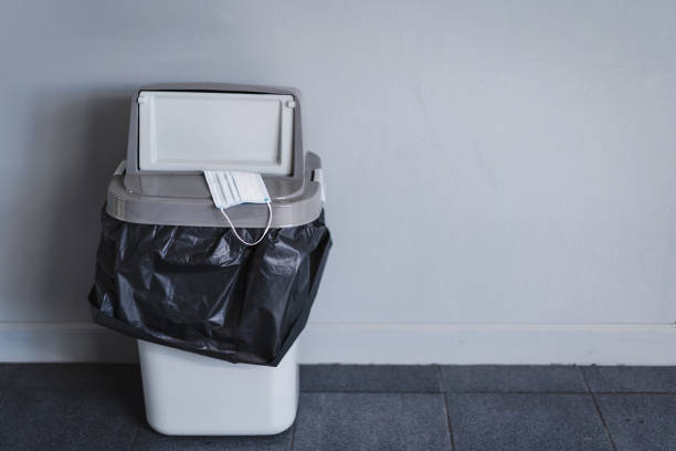 istock A used protective face mask scattered and unwell-managed in the building 1337860298
