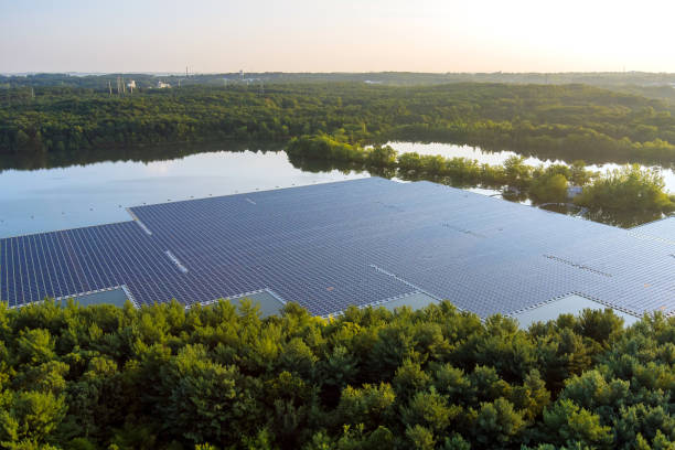 Aerial view of renewable alternative electricity energy the floating solar panels cell platform Panorama aerial view of renewable alternative electricity energy the floating solar panels cell platform on the beautiful lake floating electric generator stock pictures, royalty-free photos & images
