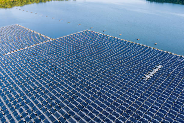Panorama aerial view of floating solar panels cell platform on the beautiful lake renewable alternative electricity energy Floating solar panels platform on the beautiful lake renewable alternative electricity energy of panorama aerial view floating electric generator stock pictures, royalty-free photos & images