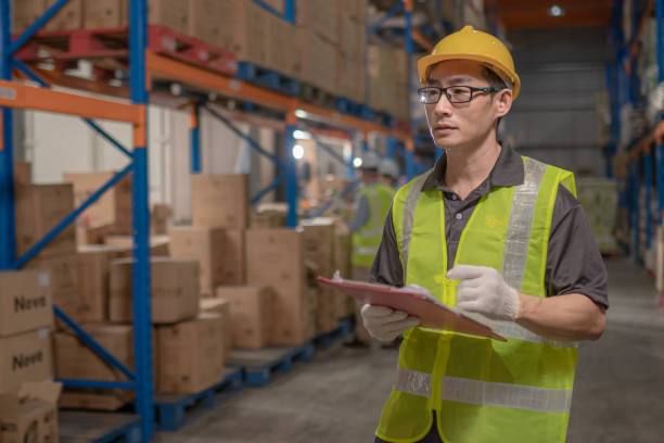 istock Asian Chinese warehouse staff stocktaking in warehouse 1337861936