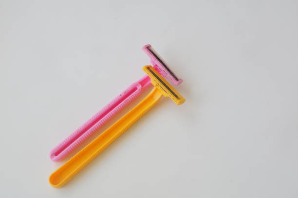 istock used pink and yellow beard razor on white isolated background photo 1337862932