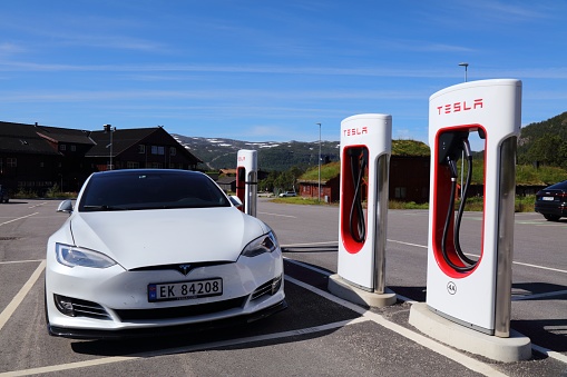 Tesla Motors electric cars parked at chargers of a Tesla charging station in mountain town of Hovden, Norway.