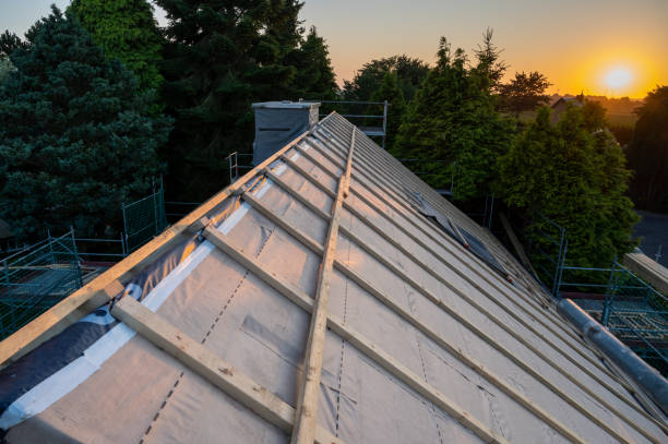 Old house gets a new roof . Picture taken at sunset. stock photo