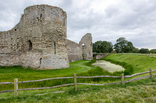 Pevencey, England - August 27, 2021: Pevensey Castle is a medieval castle and former Roman Saxon Shore fort at Pevensey in the English county of East Sussex.