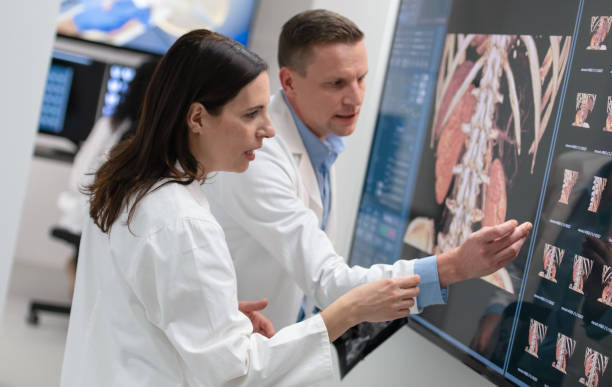 istock Doctors Consult Over An MRI Scan 1337874284