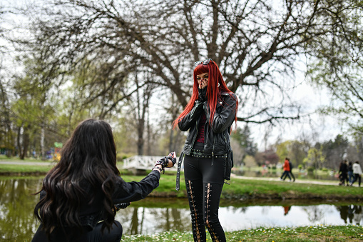 Gothic Lesbian Female Proposing To Girlfriend In Park