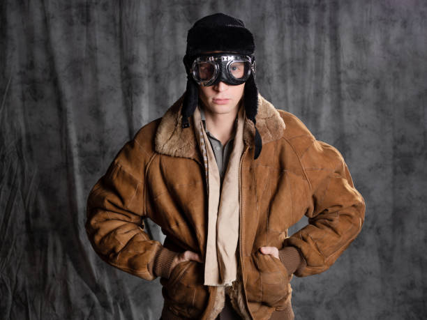 istock Retro style aviator in a flying hat with goggles on his face. 1337875174