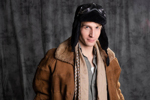 istock Pilot aviator in retro style, a young man in a flight jacket and glasses, 1337875200