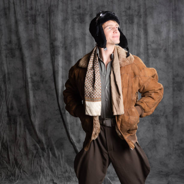 istock Pilot aviator in retro style, a young man in a flight jacket and glasses, 1337875201