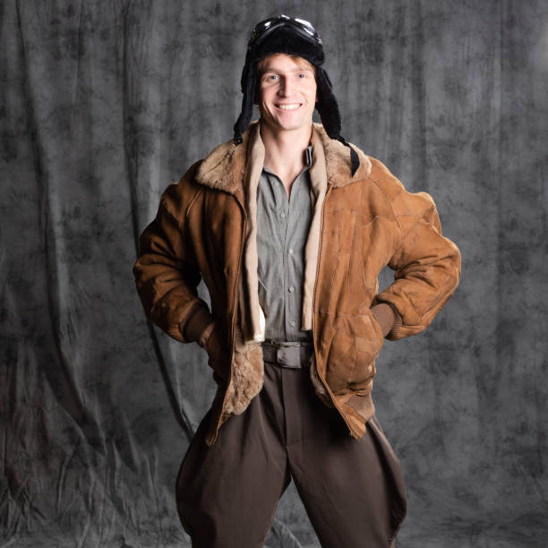 Happy smiling aviator pilot in retro style, a young man in a flight jacket